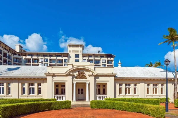 Older public architecture and later development share the streets of central Cairns.