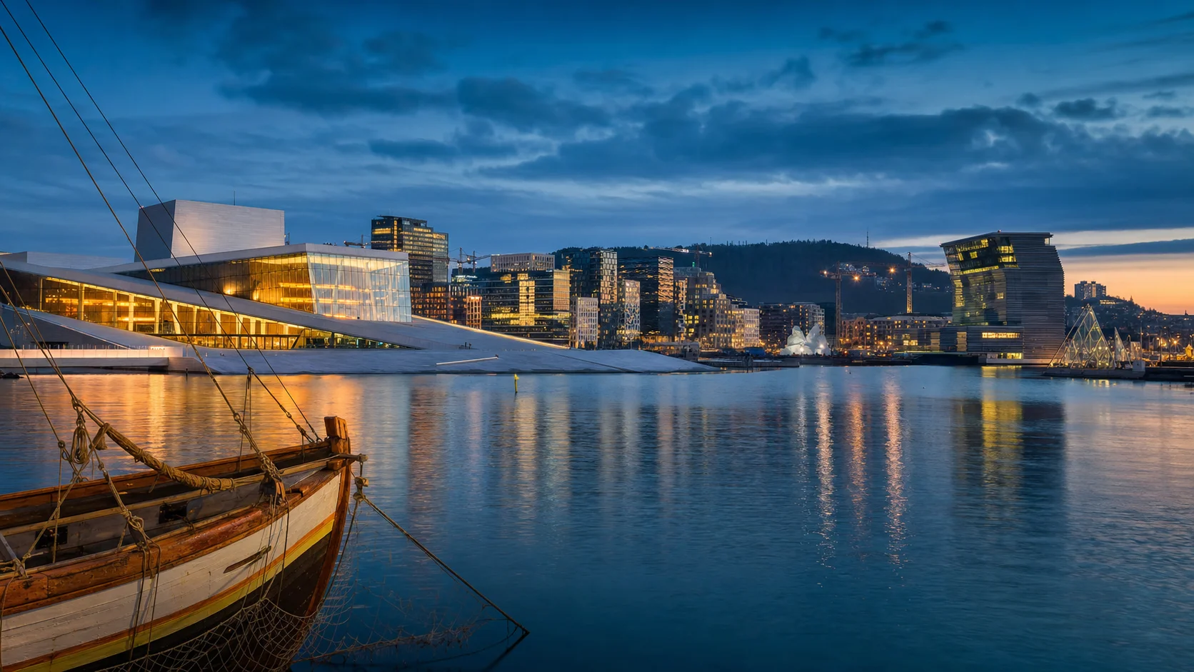 Oslo at blue hour with the fjord, warm museum lights and a restrained sense of historical continuity