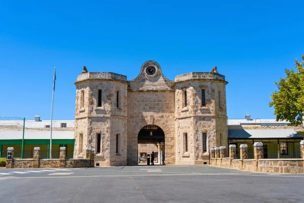 Fremantle Prison's gatehouse presents a formidable boundary between the street and the former institution.